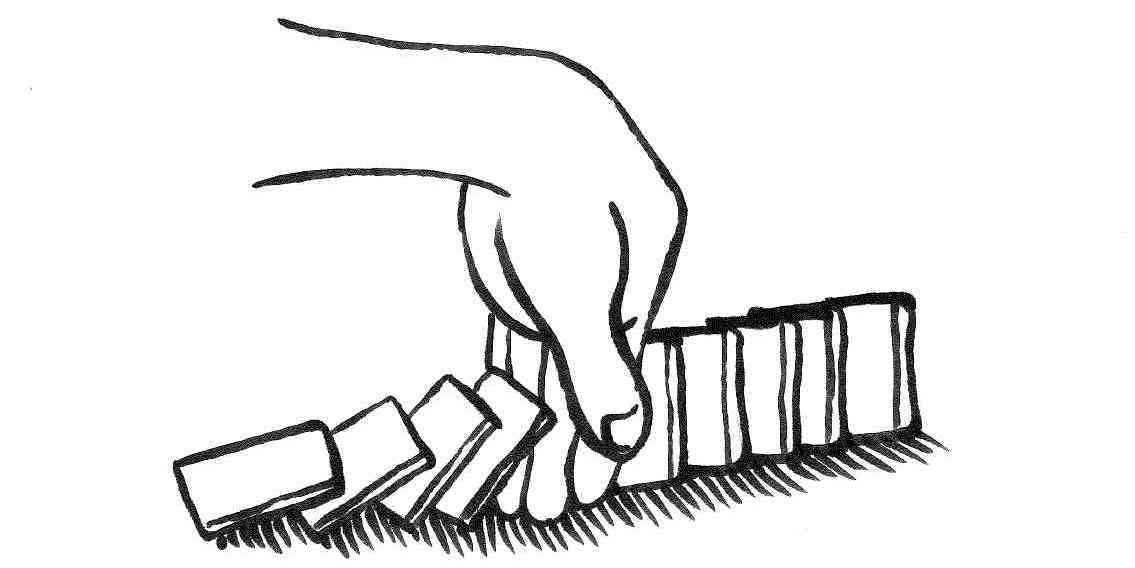 Eine laufende Dominoreihe wird unterbrochen